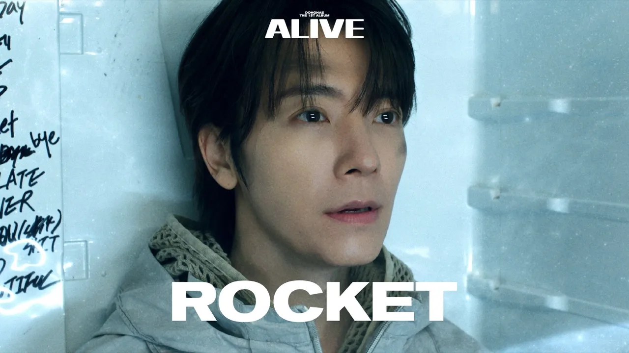 Still from the Rocket music video — DONGHAE mid-frame in the track's signature visual world